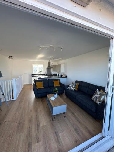 a living room with a couch and a table at Quayside in Holyhead