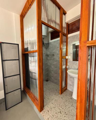 a bathroom with a toilet and a sink at Surfing Tusker - Thalpe in Talpe