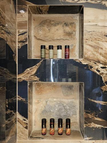 a row of bottles sitting on a shelf in a room at The House of Life in Pírgos