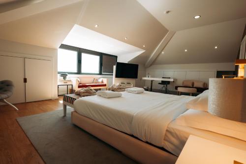 a bedroom with a large bed in a room at Borralha Hotel, Restaurante & Spa in Vila Real