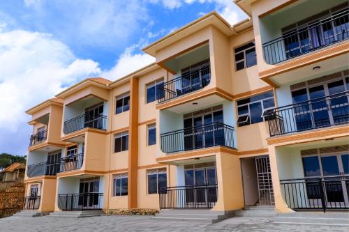 an apartment building with balconies on the side at Kampala Hilltop Haven 2 Bedroom Gem in Kampala