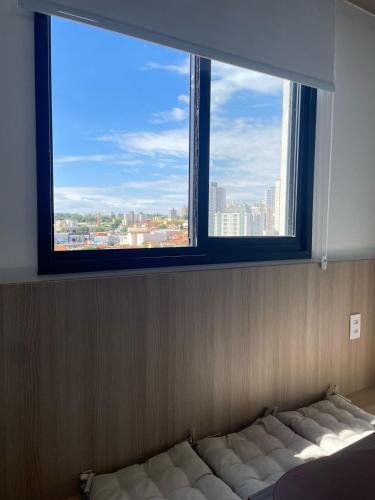Ένα ή περισσότερα κρεβάτια σε δωμάτιο στο Apartamento Completo com Piscina, Academia e Salão de festas em São Carlos
