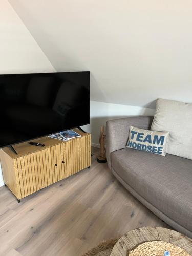 Ruang duduk di Ferienwohnung im Nordseeglück