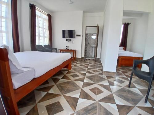 Postel nebo postele na pokoji v ubytování The coralberry Inn