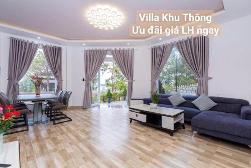 a living room with a couch and a table at Chillin Villa - Biệt Thự Đà Lạt Khu Nhiều Thông Gần Hồ Tuyền Lâm in Xuan An
