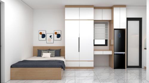 Postel nebo postele na pokoji v ubytování Ami Home Đội Cấn