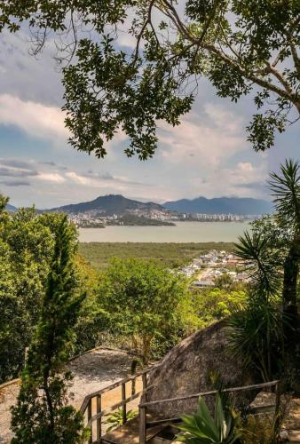 a view of a body of water from a tree at Casa da montanha Floripa in Florianópolis