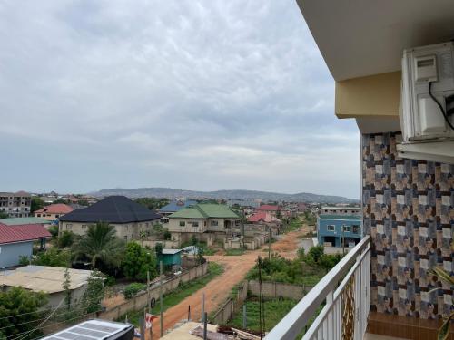 a view of a city from a balcony at Sokea Safari Lodge And Suites in Kasoa