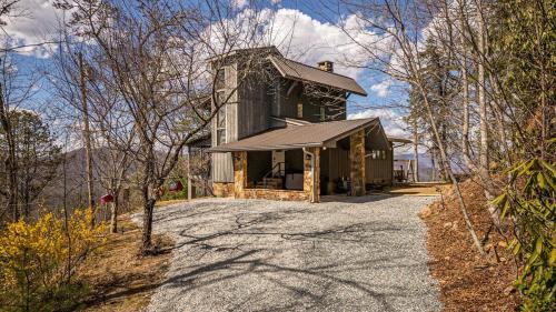 an old barn with a gravel road in front of it at SMOKY MOUNTAIN MAGIC-Spectacular Views, 3 Br, Sleeps 8, Hot Tub in Bryson City