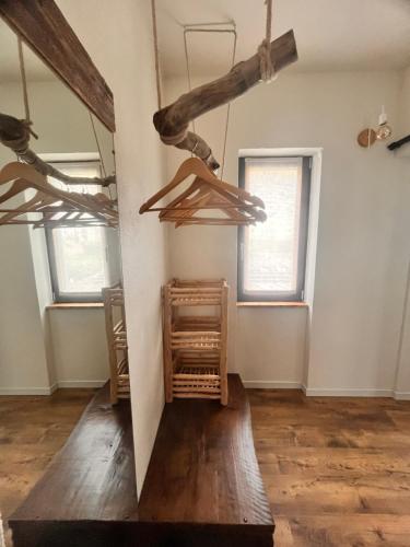 a room with wooden beams on the wall at Stanza in sondrio Coel in Sondrio