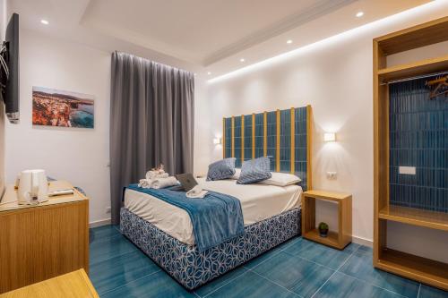 Postel nebo postele na pokoji v ubytování Relais S Francesco