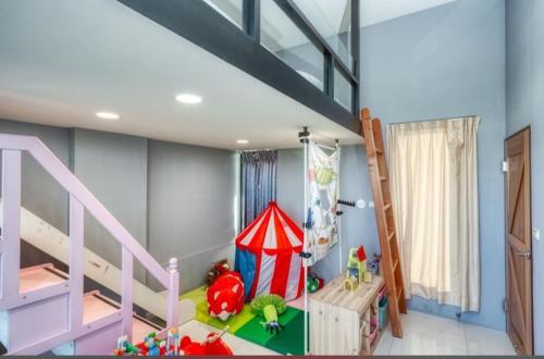a childs bedroom with a bunk bed and a play tent at Nine in Wujie