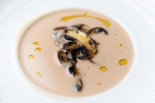 a white plate with some food on it at Borralha Hotel, Restaurante & Spa in Vila Real