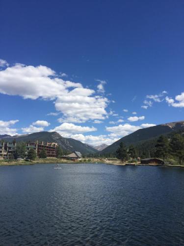 a view of a lake with mountains in the background at Montezuma 1770 by SummitCove Lodging in Keystone
