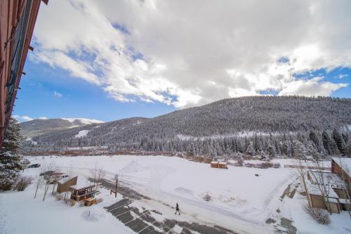 a view of a snow covered field with a mountain at Montezuma 1770 by SummitCove Lodging in Keystone