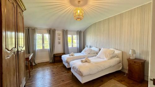 Ένα ή περισσότερα κρεβάτια σε δωμάτιο στο Maison familiale au cœur du Marquenterre