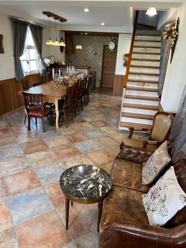 a living room with a couch and a table at 維瓦利 in Sanxing