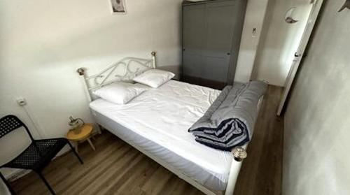 Ένα ή περισσότερα κρεβάτια σε δωμάτιο στο appartement au bord de l'océan
