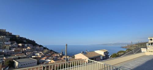 a view of a town with the ocean in the background at Residenza Albachiara in Castelsardo