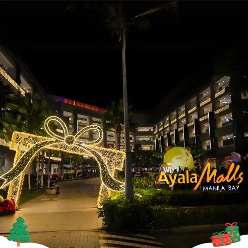 a christmas light display at a mall at night at Luxury Penthouse & High-Floor Hotel near City of Dreams, Airport, Okada, and Solaire Casino in Manila