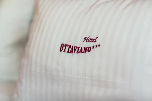 a close up of a white shirt with red writing on it at Hotel Ottaviano in Świnoujście