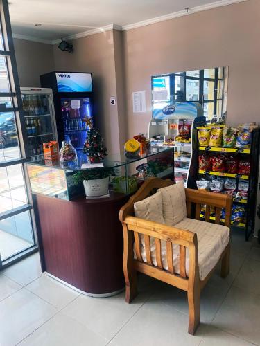 a store with a bench in front of a counter at Hotel NIKYASAN in Antofagasta