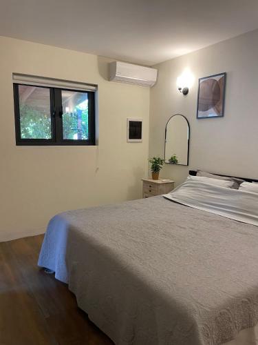 a bedroom with a bed and a window at Spacious modern apartments in Noord