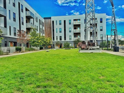 a large green field in front of a building at Cobalt Cove (132) in Des Moines