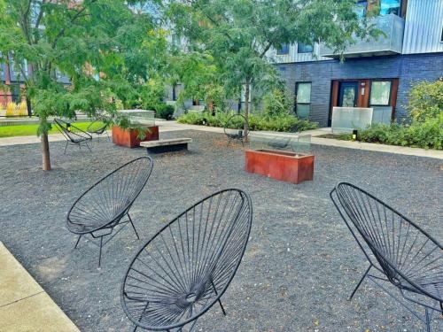 a group of chairs sitting in a park at Cobalt Cove (132) in Des Moines