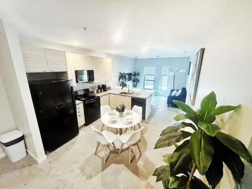 a kitchen with a table and chairs in a room at Cobalt Cove (132) in Des Moines
