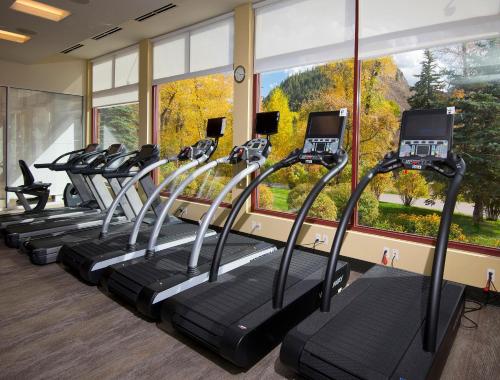 a row of treadmills in a gym with a large window at Westin #215 A- 1 Bedroom in Avon