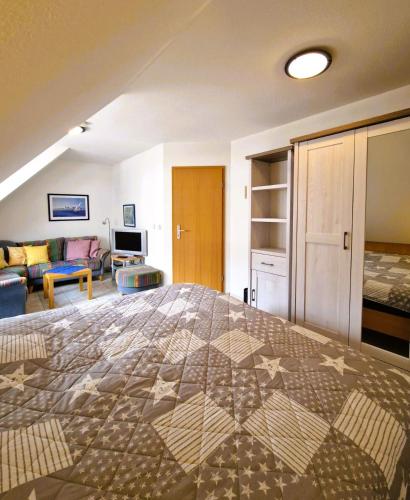 a bedroom with a large bed in a room at Seestr 75 a Haus A links in Zingst