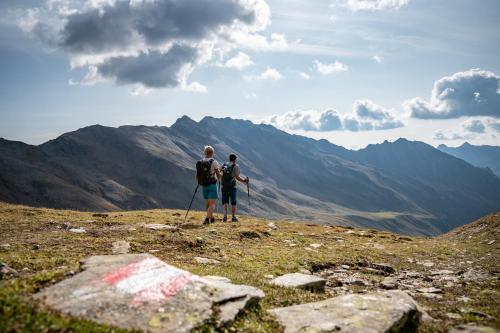two people standing on the top of a mountain at Rainer Apartment in Sillian