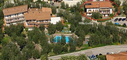 an aerial view of a house with a swimming pool at Villa Ersilia in Limone sul Garda