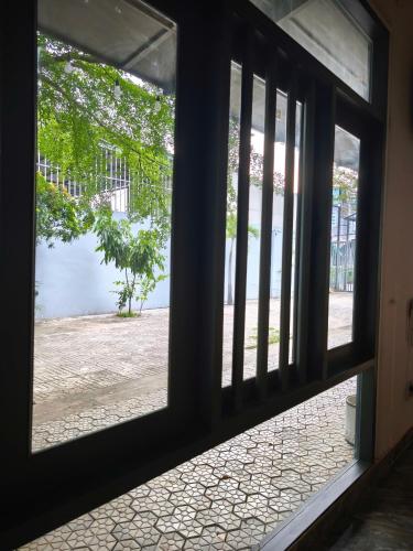 a view through a window of a building at Long Homestay Mỹ Hạnh - Hotels in Ðức Hòa