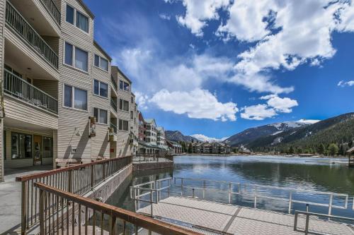 a view of the lake from the balcony of a apartment building at Lakeside 1496 by SummitCove Lodging in Keystone