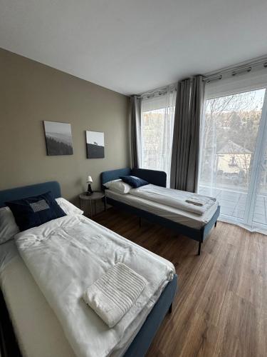 Una cama o camas en una habitación de Nest Natur Hostel