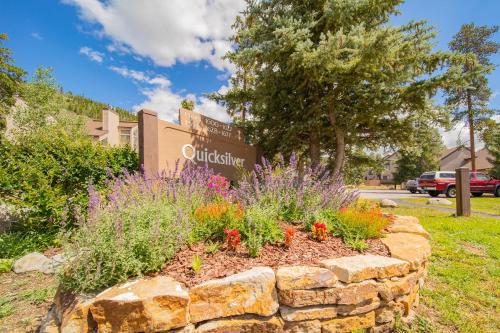 a flower bed in front of a university sign at Quicksilver 1613 by SummitCove Lodging in Keystone