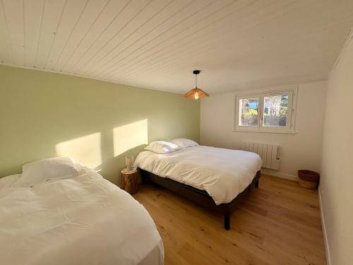 Ένα ή περισσότερα κρεβάτια σε δωμάτιο στο Chalet 14pers - jacuzzi&sauna - La Bresse
