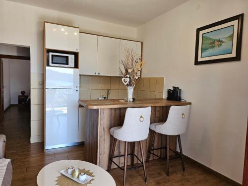 a kitchen with a counter and some white appliances at Apartments Nadja in Kotor