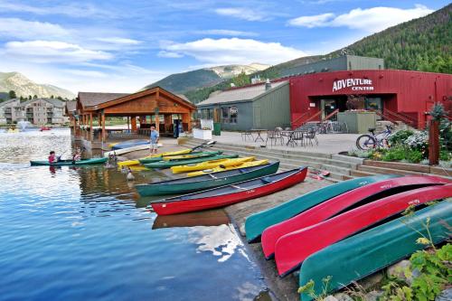 a bunch of boats are lined up on the water at Lakeside 1495 by SummitCove Lodging in Keystone