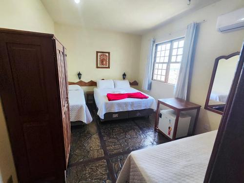 Katil atau katil-katil dalam bilik di Hotel Montanhas de Minas