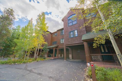 a large brick building with a parking lot in front of it at Starfire 1992 by SummitCove Lodging in Keystone