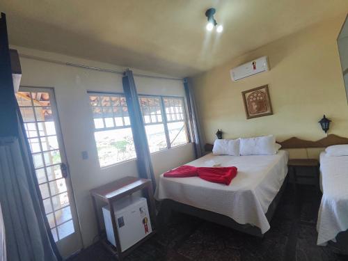 Katil atau katil-katil dalam bilik di Hotel Montanhas de Minas