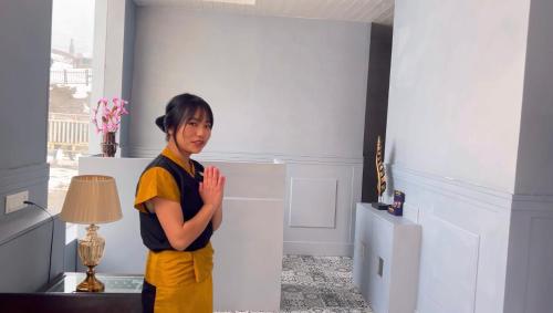 a young boy standing in a room with his hands at Country Inn Suites by Radisson Sonamarg in Sonāmarg