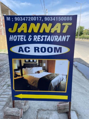 a sign for a hotel and restaurant ac room at Jannat Hotel & Restaurant in Karnāl