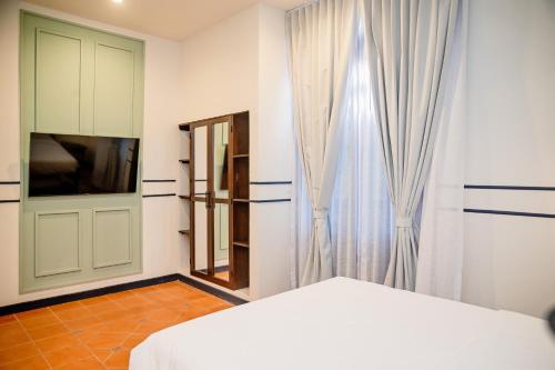 Телевизор и/или развлекательный центр в voco Lake Nicaragua - Granada by IHG