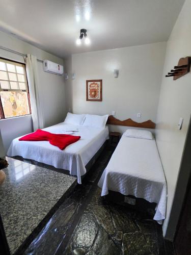 Katil atau katil-katil dalam bilik di Hotel Montanhas de Minas