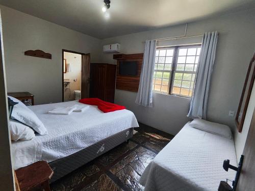 Katil atau katil-katil dalam bilik di Hotel Montanhas de Minas