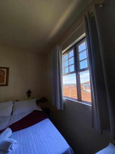 Katil atau katil-katil dalam bilik di Hotel Montanhas de Minas